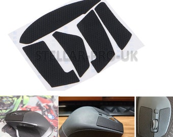 May include: A set of black mouse feet pads for a gaming mouse. The pads are textured and come in various shapes and sizes to fit different mouse models. The pads are shown on a white background.