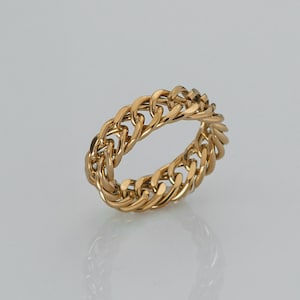May include: A gold-toned ring with a chain-link design.