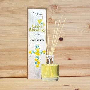 May include: A reed diffuser with a yellow and blue floral design on the box. The box says "Regent House Easter Blessings Reed Diffuser".