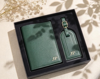 May include: A dark green passport holder and a matching luggage tag set, both featuring a textured finish and the gold-colored initials JP embossed on the front. The items are presented in a black rectangular gift box with custom cutouts.