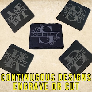 May include: Five black slate coasters with engraved names and decorative flourishes. The names are "Mann", "Seeley", "Schoonmaker", "Rudock", and "Domingue". The coasters are for sale and are advertised as "Continuous Designs Engrave or Cut".