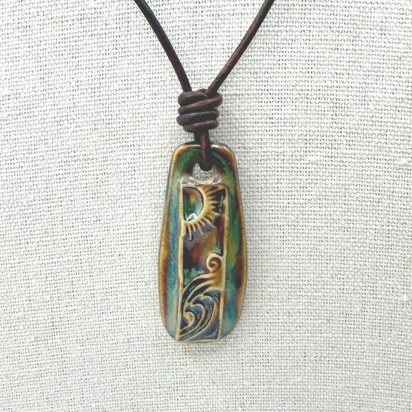 Ceramic Pendant Necklace bright sun waves handmade pendant on brown leather cord.
