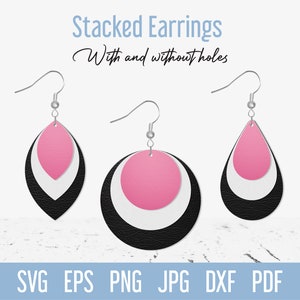 May include: Three pairs of stacked leather earrings with pink, white, and black layers. The earrings are shown on a white wooden surface. The text "Stacked Earrings With and without holes" is at the top of the image.