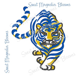 May include: An embroidery design of a tiger featuring bold blue and yellow stripes with black outlines. The tiger is depicted in a dynamic, forward-facing pose with its tail curved upward. The text Sweet Magnolia Blooms appears repeatedly.