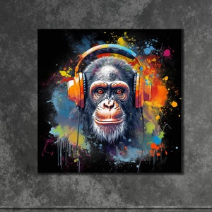 May include: A colourful abstract painting of a chimpanzee wearing headphones. The chimpanzee has a black face and fur, and the headphones are orange. The background is a dark blue with splashes of colour.