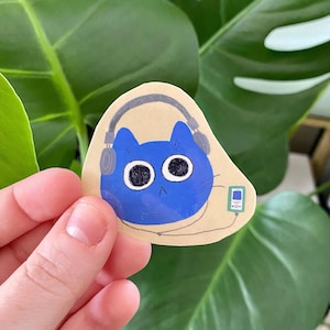 Sticker chat avec casque, chat bleu mignon avec casque de soutien émotionnel, idées cadeaux pour journalisme neurodivergent autiste
