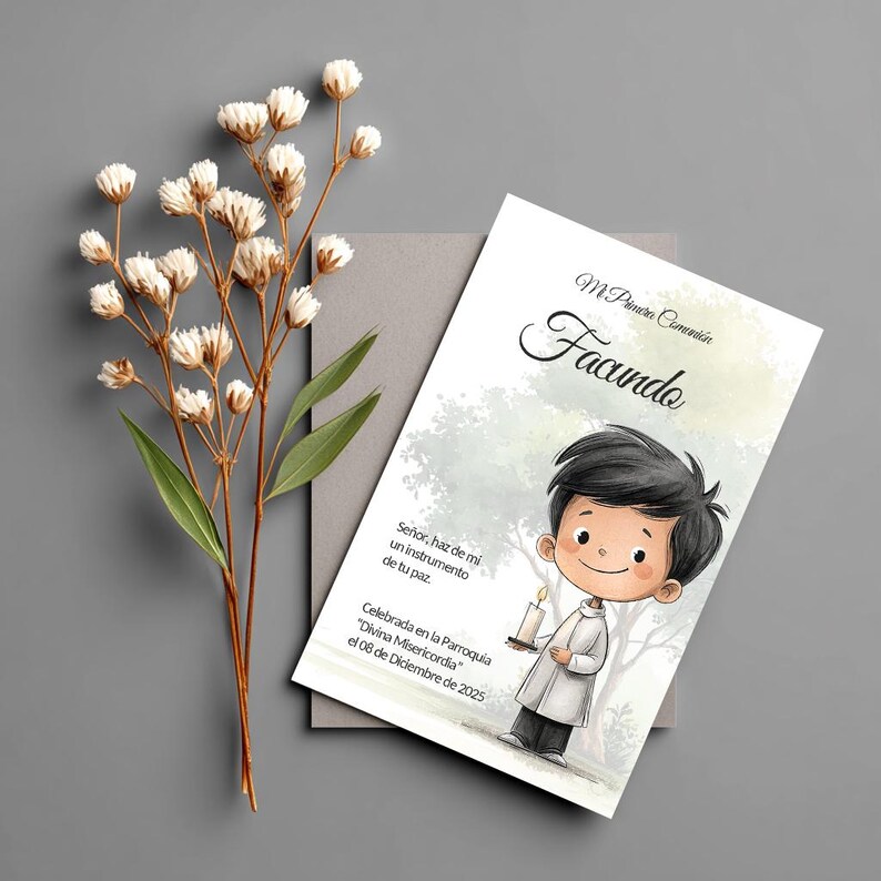 May include: A rectangular invitation card featuring a cartoon illustration of a boy holding a candle, with the text Mi Primera Comuni&oacute;n, Facundo, and Spanish religious phrases. Beside the card is a sprig of dried white flowers with green leaves.