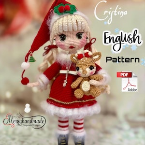 May include: A handmade crochet doll dressed in a red Santa-style outfit with white trim, holding a small brown reindeer. The doll has blonde hair, a red hat, and black boots. The text "English Pattern" is visible.