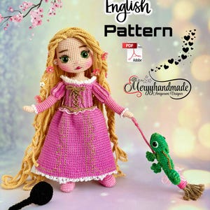 May include: A handmade crochet doll of a princess in a pink dress with long blonde hair. The doll holds a green chameleon on a stick. The words "English Pattern" are at the top of the image.