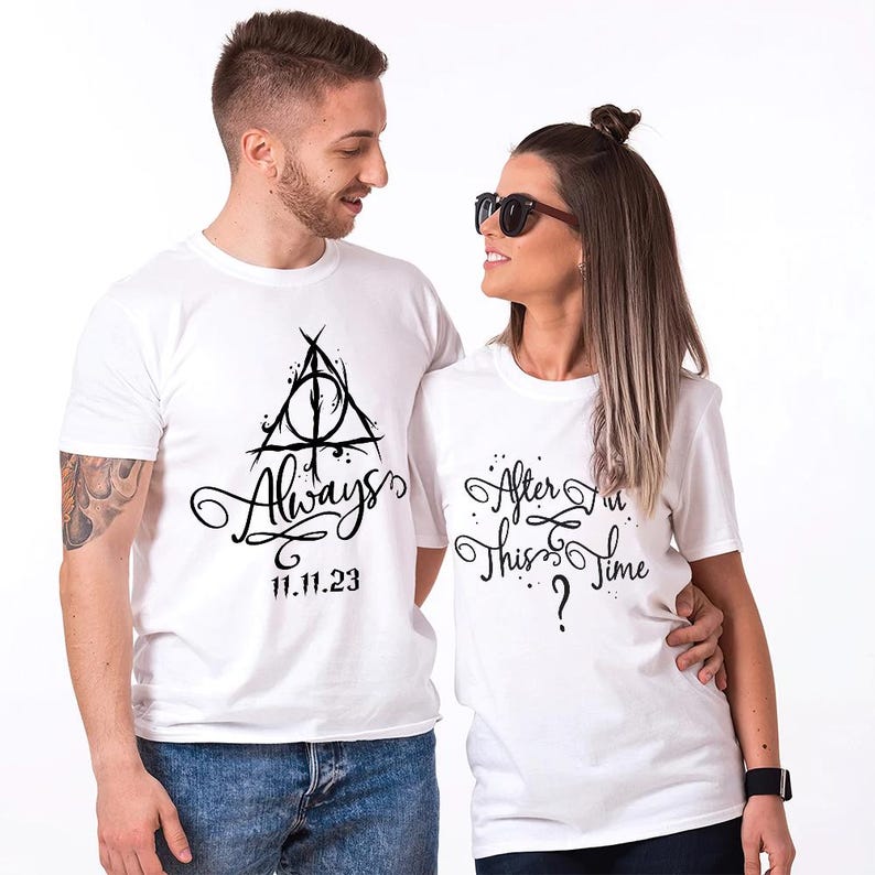 May include: A couple wearing white t-shirts with a Harry Potter themed design. The man's shirt features the Deathly Hallows symbol and the text "Always" with the date "11.11.23". The woman's shirt features the text "After all this time?"