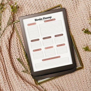 May include: A printable brain dump planner with sections for "To Do", "Ideas to Explore", "Tasks", "Things to Buy", "Work Ideas", "Wondering About", "To Read", and "Need to Process".