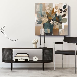 May include: A modern abstract painting of a floral arrangement in a blue vase. The painting features shades of brown, beige, and teal. The painting is displayed on a white wall above a black metal console table with a white ceramic sculpture and two black candlesticks.
