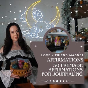 May include: A wooden bowl containing small, colorful jars with text that reads LOVE / FRIEND MAGNET, AFFIRMATIONS, 30 PREMADE AFFIRMATIONS FOR JOURNALING. The jars are filled with various items, and the background features a glowing yellow moon neon sign.