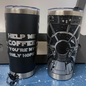 May include: Two stainless steel tumblers with black and silver designs. One tumbler features the text "Help Me Coffee You're My Only Hope" and the other features a Star Wars themed design.