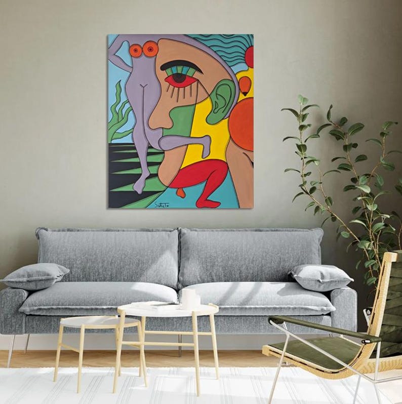 May include: Abstract painting of a face with a green, yellow, red, and blue colour scheme. The face is surrounded by other figures, including a woman in a purple dress.