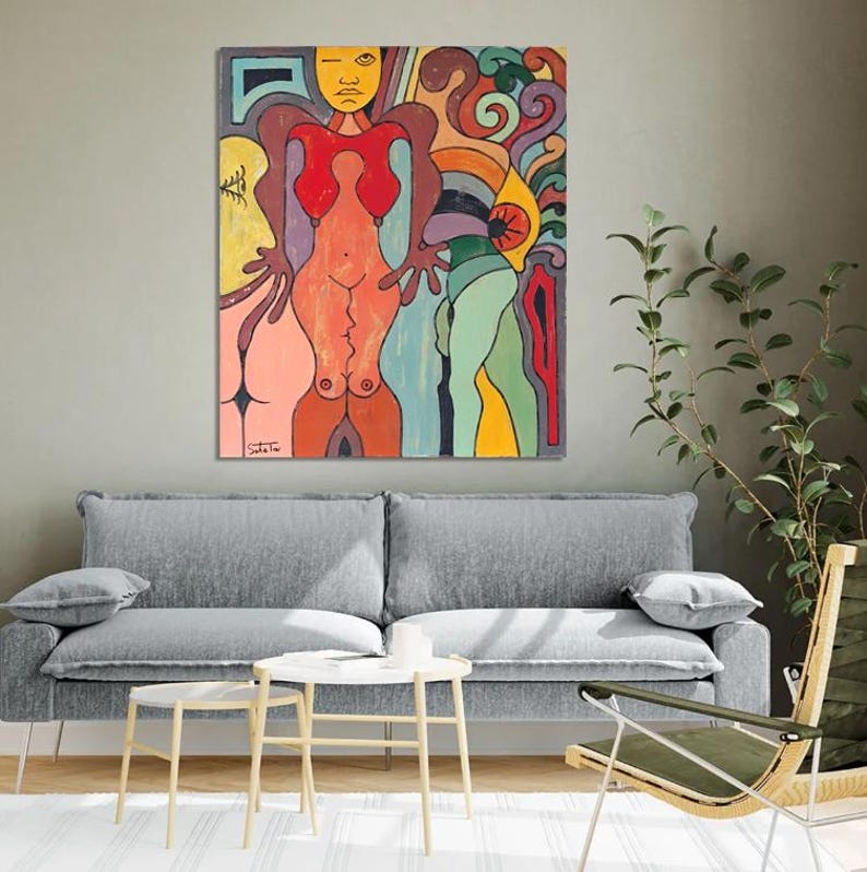 May include: A rectangular canvas painting featuring a stylized, abstract figure with a yellow face and red torso, surrounded by vibrant, swirling shapes in shades of orange, purple, green, and blue. The artwork includes bold black outlines.