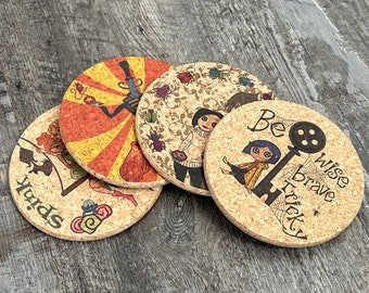 May include: Set of four round cork coasters with colorful illustrations. Designs include a character with a top hat, a character with bugs, a character with a key and the words "Be Wise Brave Tricky", and a character with the word "Spink".
