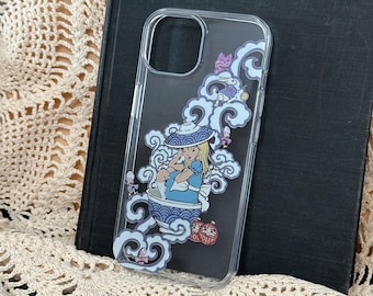 May include: A clear phone case with a colorful design featuring a girl in a blue dress sitting in a teacup. The design also includes a white rabbit, a cat, and a crown.