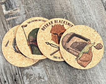 May include: Four round cork coasters with different Star Wars characters and quotes. The coasters feature a Mandalorian, a Boba Fett, a Grogu, and a  Boba Fett with the quote "You can run, but you'll only die tired".