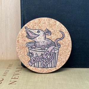 Image of the Eating my emotions possum design featuring a possum in a trash can