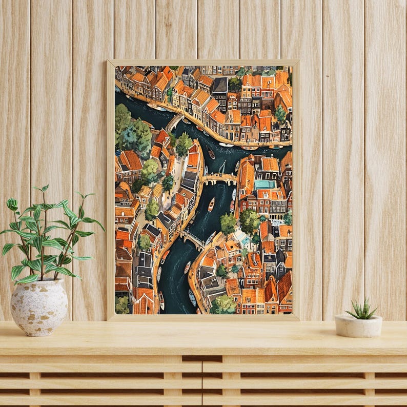 May include: An aerial view illustration of a city with canals and buildings. The buildings are mostly orange and brown with some green trees. The canals are blue and there are boats on the water.