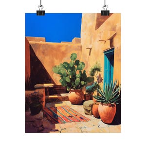May include: A print of a courtyard scene with a bright blue sky. The walls are a warm orange, and a turquoise door is visible. Large terracotta pots hold cacti and other plants. A colorful rug sits on the stone floor.