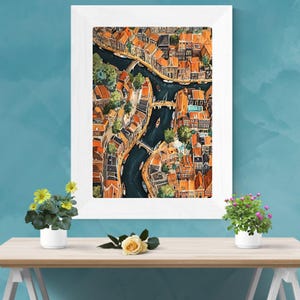 May include: A watercolour painting depicting an aerial view of a city with a network of canals and bridges. The buildings are painted in shades of orange, red, and brown. The canals are a deep blue colour.