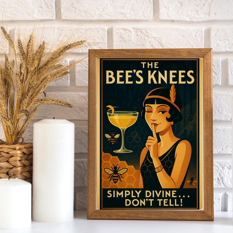 A vintage style poster with a woman in a black dress and a feather headband. She is holding her finger to her lips and looking at the viewer. The poster has a yellow and black honeycomb pattern and text that reads 'The Bee's Knees, Simply Divine... Don't Tell!'.
Bee's Knees Vintage Poster | Simply Divine Flapper Art | 1920s Gin Honey Cocktail Print | Art Deco Bar Wall Decor | Speakeasy Gift