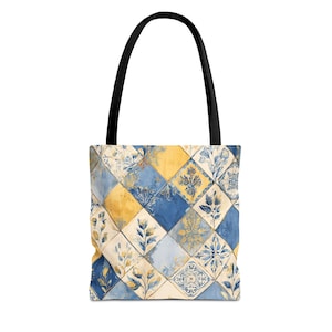 May include: A tote bag with a black handle and a colorful tile pattern. The pattern features blue, yellow, and cream-colored squares with floral and geometric designs. The bag is made of a sturdy material and is suitable for carrying various items.
