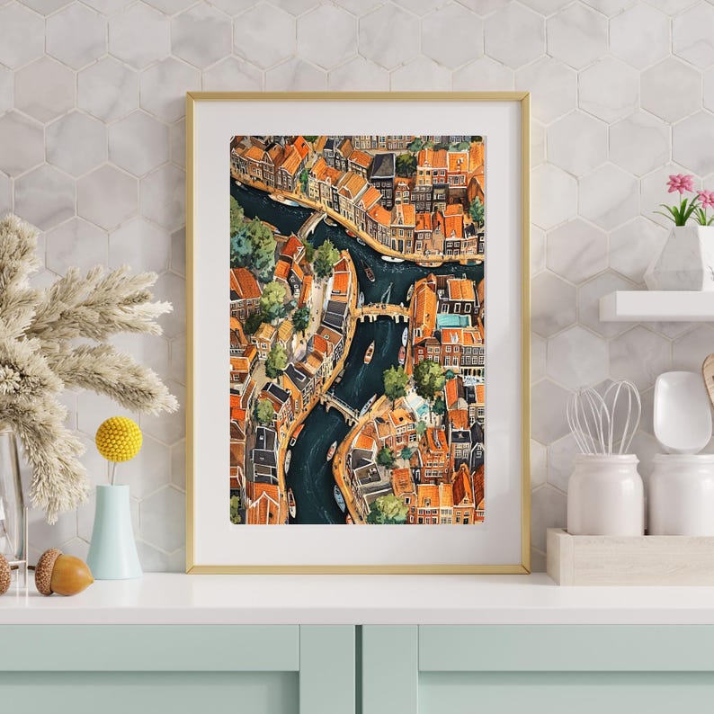 May include: A watercolour painting depicting an aerial view of a city with canals and buildings. The buildings are predominantly orange and brown with some green trees. The canals are dark blue and there are boats on the water.