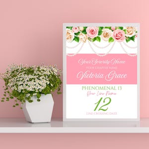 May include: A pink and white printable sign with a floral border and pearl garland. The text reads "Your Sorority Name", "Your Chapter Name", "Victoria Grace", "Phenomenal 13", "Your Line Name", "12", and "Line Crossing Date".
