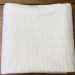 Colette Textured Geo White on White fabric by Whistler Studios. 2 1/2 yards available. Intricate geometric design.