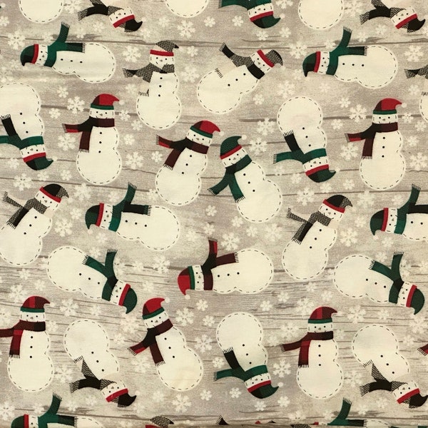 Festive Christmas Fabric: Snowman and Snowflakes Pattern. Soft, warm and cozy flannel. Perfect for quilts, pillow cases and more!