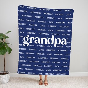May include: A navy blue blanket with the word "grandpa" in white, surrounded by a repeating pattern of names, including Jack, Christine, Alexandra, Michelle, and Rachael.