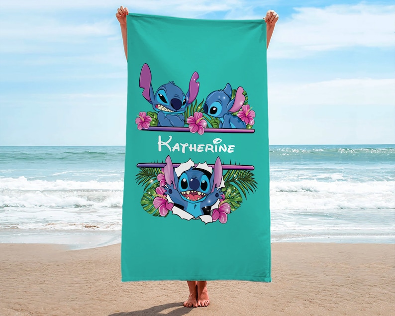 May include: A turquoise beach towel with a personalized name "Katherine" printed in white. The towel features a repeating pattern of Stitch characters from the Disney movie Lilo & Stitch, surrounded by tropical flowers and leaves.