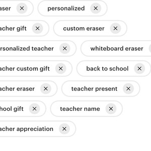 May include: A collection of white buttons with black text, each with a red 'X' mark. The buttons include phrases like 'teacher gift', 'personalized teacher', 'teacher eraser', 'school gift', 'teacher appreciation', 'custom eraser', 'whiteboard eraser', 'back to school', 'teacher present', 'teacher name', 'eraser', 'personalized', 'teacher custom gift'.