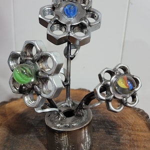 Flowers - metal art made out of nuts and bolts, metal base