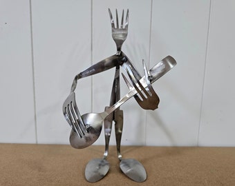 Guitar player, made with spoons and forks, metal art