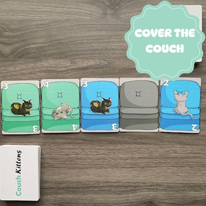 May include: A game called "Couch Kittens" with five cards showing different colored couches with cats on them. The cards are numbered 2, 3, and 4. The text "COVER THE COUCH" is on a teal circle.