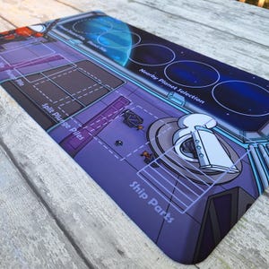 Butts in Space : Plungers and Planets Playmat - Tapis de jeu en néoprène 14 x 24 po.