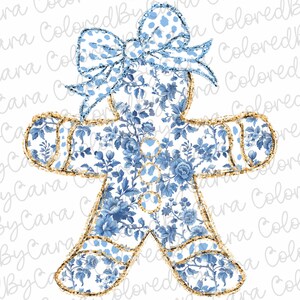 May include: A blue and white gingerbread man cookie with a blue and white polka dot bow. The gingerbread man is outlined in gold glitter.