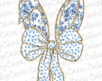 Può includere: Un fiocco blu e bianco con accenti di glitter dorati. Il fiocco è annodato e presenta un motivo floreale.