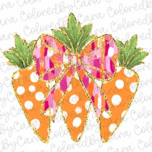 May include: Three orange carrots with white polka dots and gold glitter trim are tied together with a pink and orange plaid bow. The carrots have green tops.