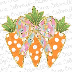 May include: Three orange carrots with white polka dots and green tops are tied together with a pink and blue bow with gold glitter accents.
