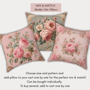 May include: Three decorative throw cushions with floral patterns. The cushions feature pink and blue backgrounds with large pink roses and green foliage. The text "MIX & MATCH Shabby Chic Pillows" is at the top.