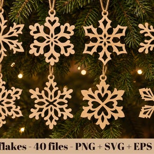 May include: Eight light brown wooden snowflake ornaments with intricate laser-cut patterns, each suspended by a thin twine loop. The text at the bottom reads: Snowflakes - 40 files - PNG + SVG + EPS + DXF. These are flat, decorative cutouts.