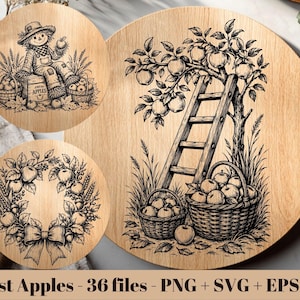 Puede incluir: Tres superficies circulares de madera con ilustraciones de línea negra sobre temas de cosecha. Una muestra un espantapájaros con cestas de manzanas, otra una corona de manzanas con un lazo, y la mayor un manzano con escalera y cestas.