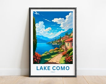 May include: A framed poster featuring a colourful illustration of Lake Como in Italy. The poster depicts a scenic view of the lake, mountains, and a small village with red-roofed houses. The text "LAKE COMO" and "ITALY" is printed in blue on a white background.