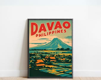 May include: A framed travel poster with the word "DAVAO" in red above "PHILIPPINES". The poster shows a mountain, a town, and water in blue, green, and orange hues. The poster is a vintage style travel advertisement.