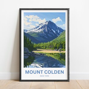 May include: A framed print of Mount Colden in New York. The artwork depicts a mountain with snow-capped peaks, lush green forests, and a serene lake reflecting the sky. The text "Mount Colden New York" is printed at the bottom.